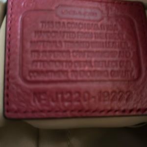 Tan, monogram canvas coach purse with red leather trim